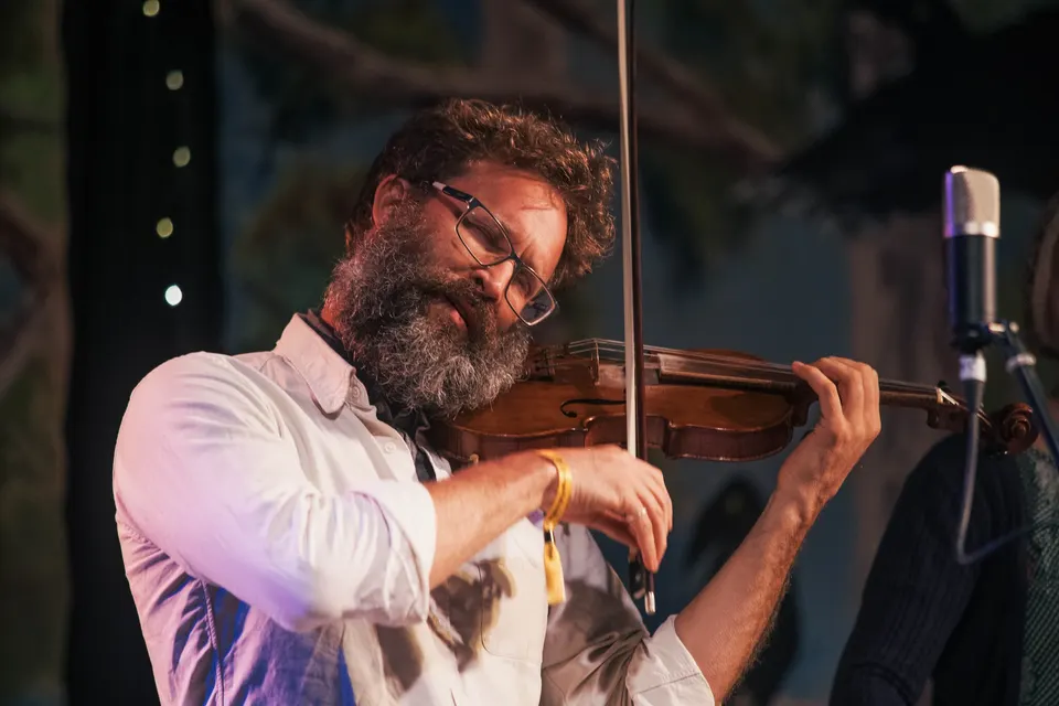 The band's fiddler, eyes closed, deep in a tune
